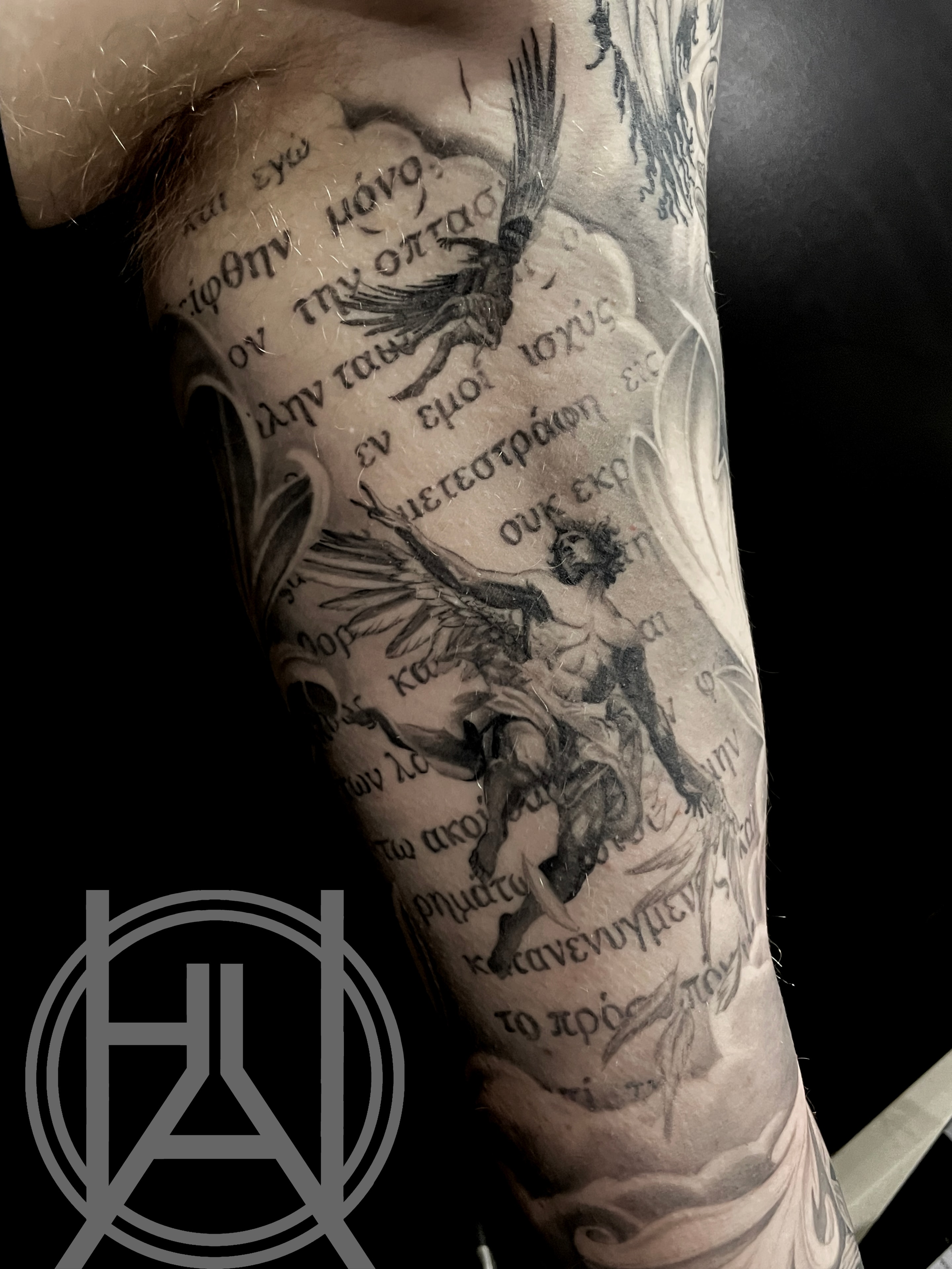 Angels with Greek scripture sleeve — black and grey realism