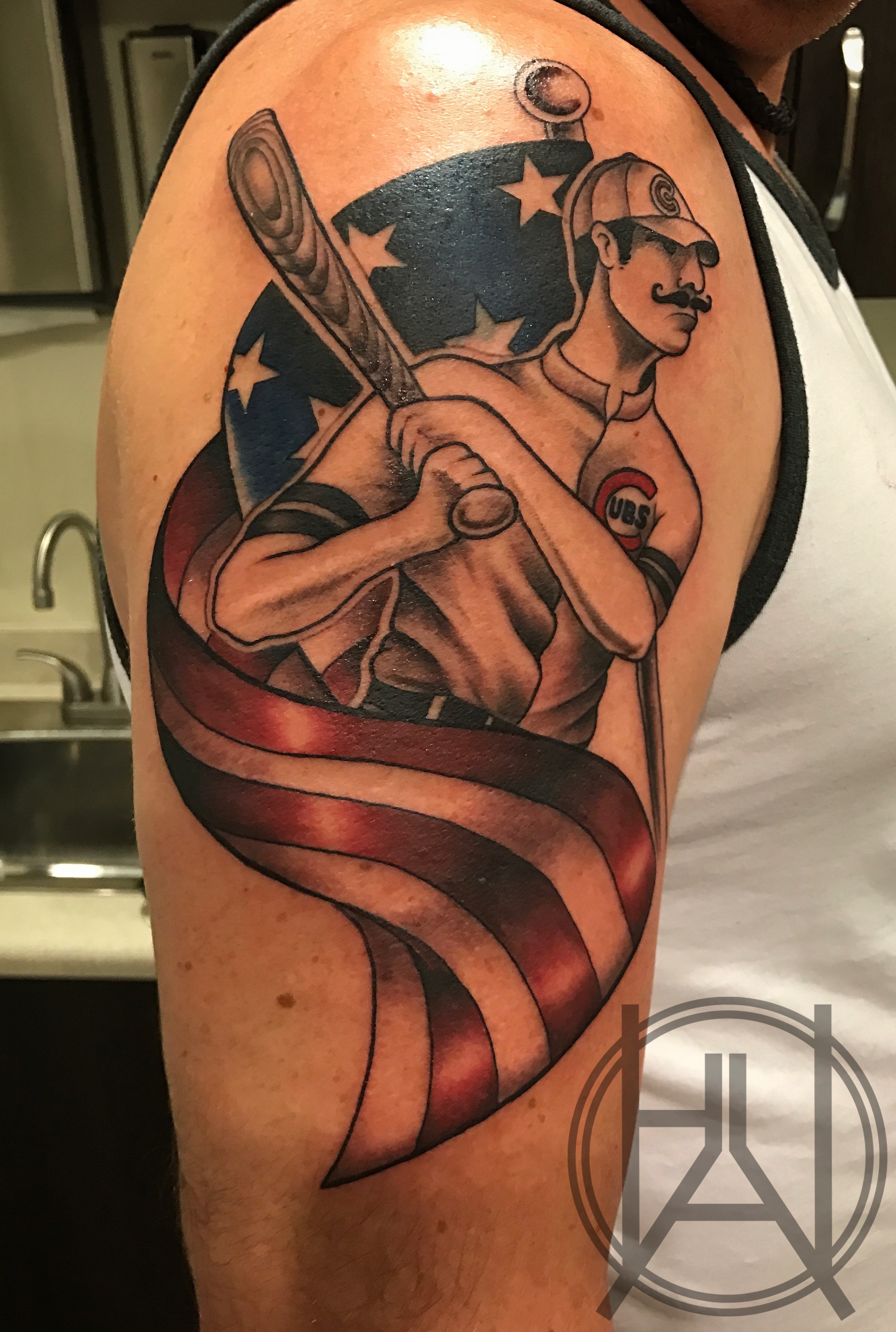 Chicago Cubs baseball player with American flag banner — color cover-up upper arm