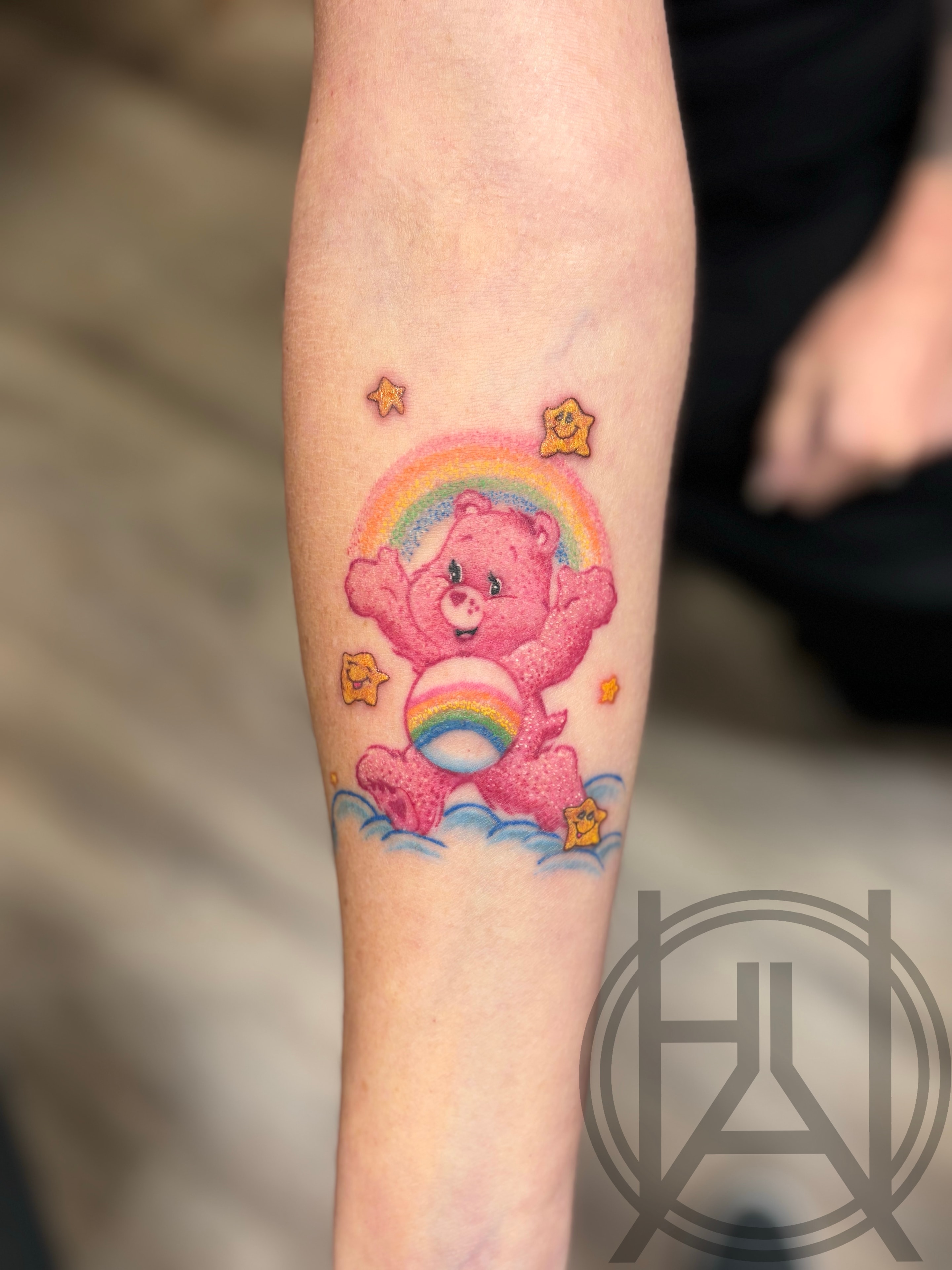 Care Bear with rainbow and stars — vibrant color forearm