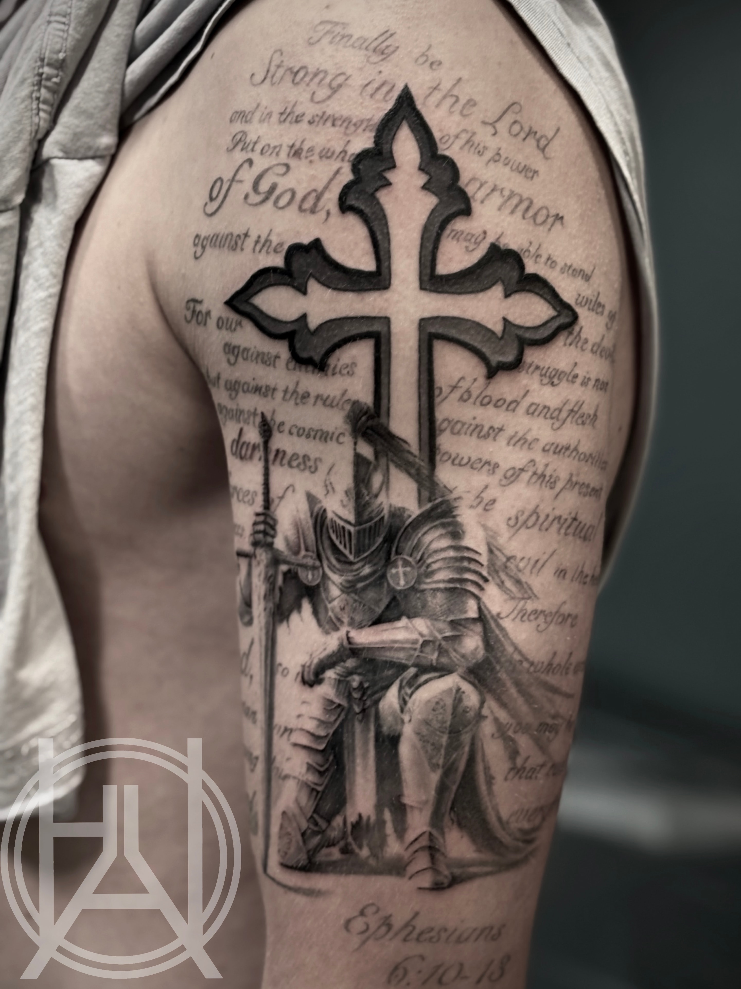 Cross with Ephesians scripture and kneeling knight — black and grey upper arm