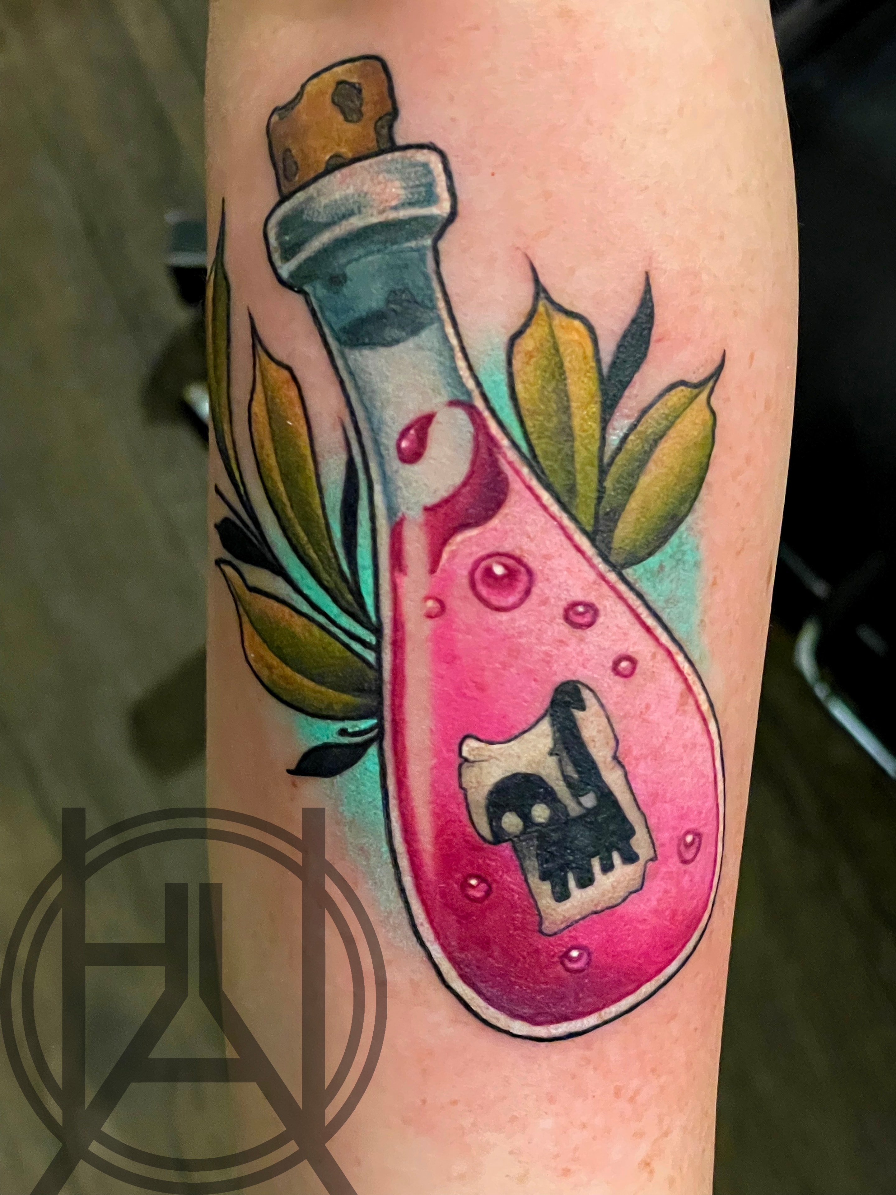 Poison bottle with skull label and leaves — neo traditional color forearm
