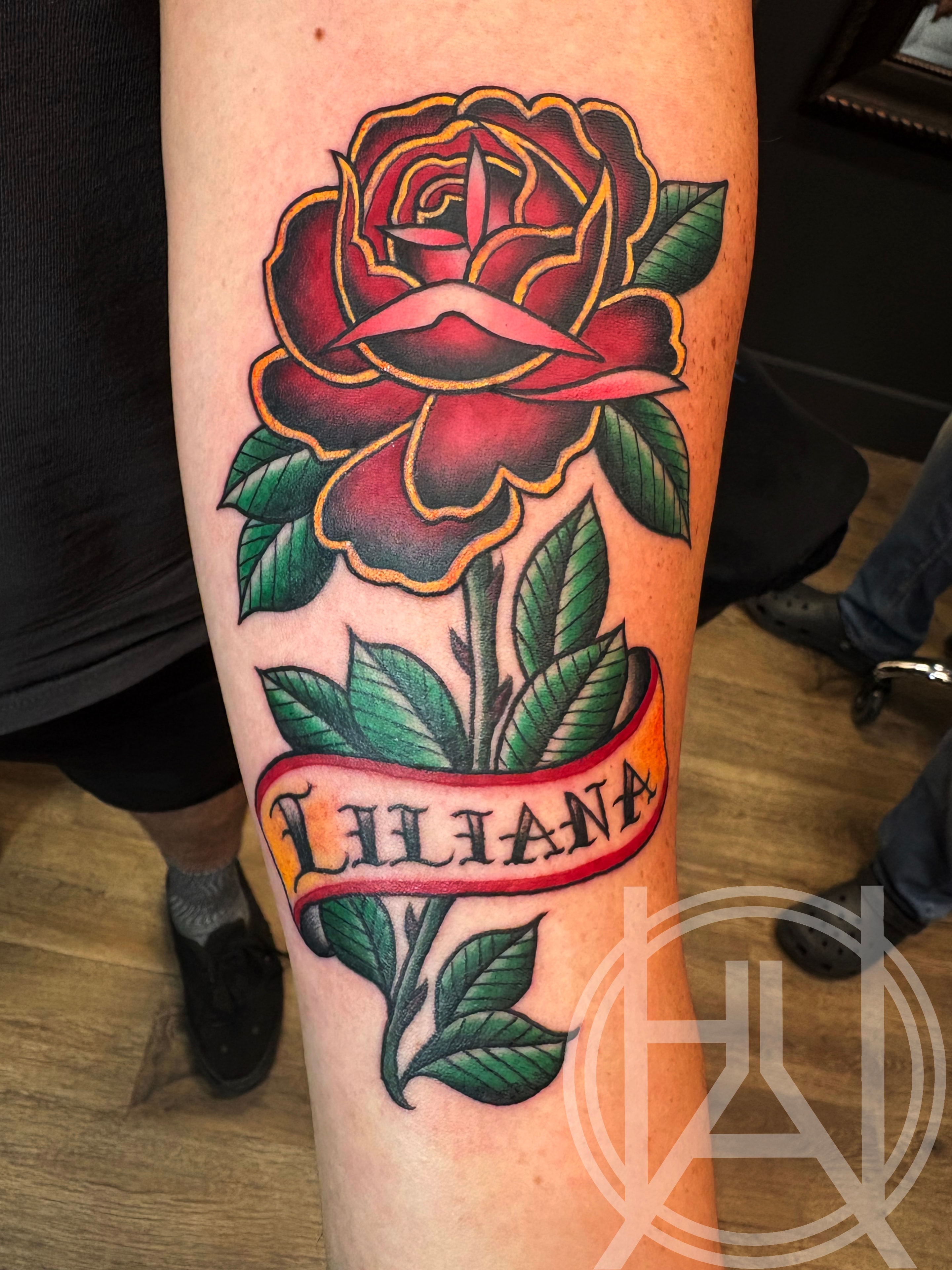 Traditional red rose with Liliana name banner — color forearm