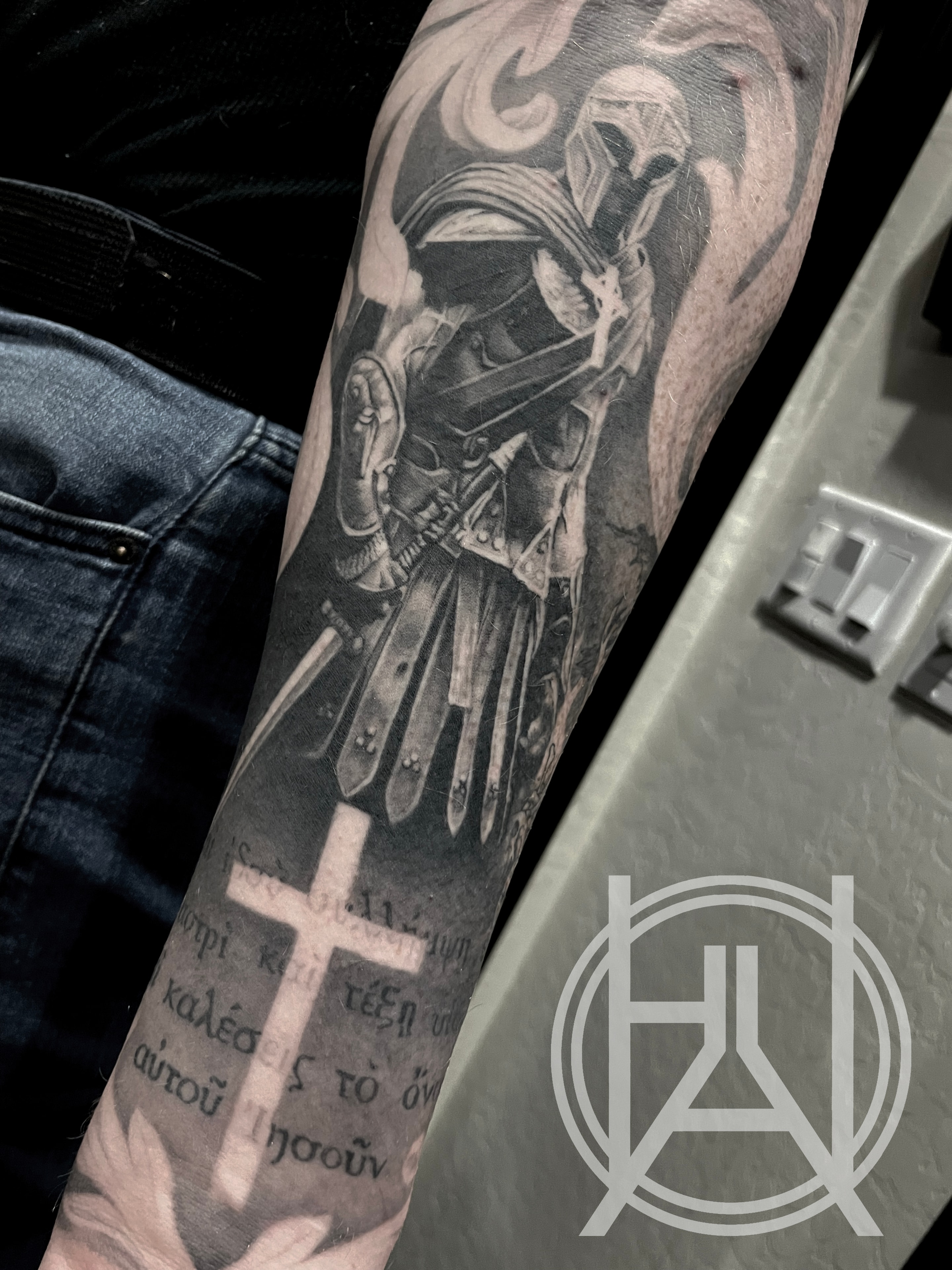 Warrior with cross and Greek text — black and grey forearm sleeve