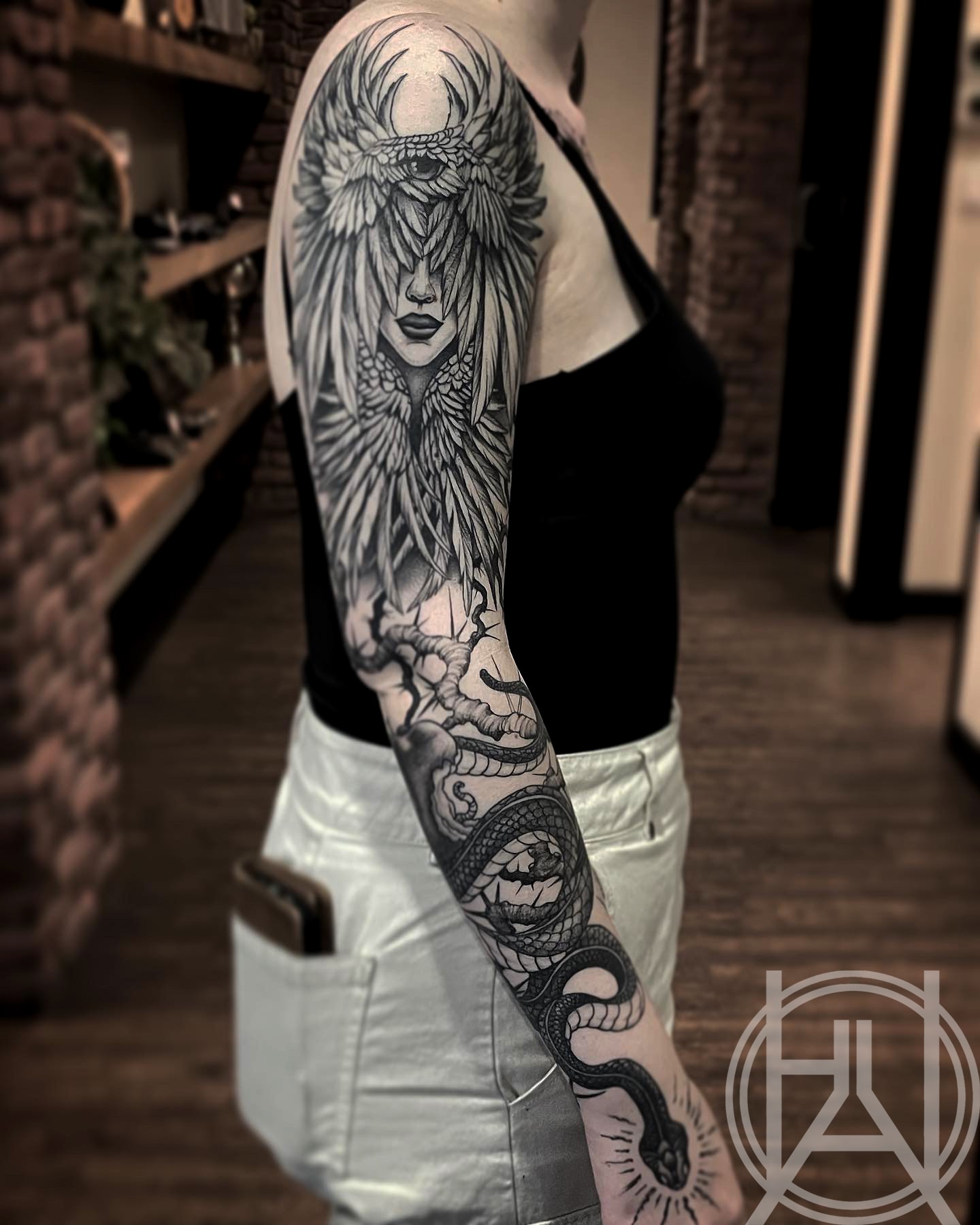 Winged goddess with serpent full sleeve — dot work
